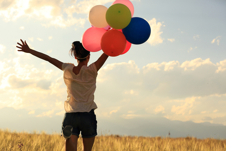 Woman feeling free, detached, and at peace.
