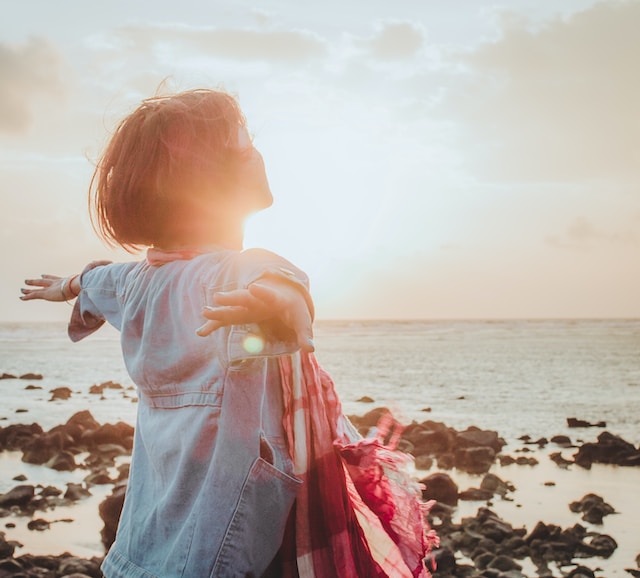 Woman smiling, happy. Photo by Fuu J on Unsplash